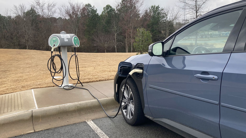 Car Plugged into EV Charging Station